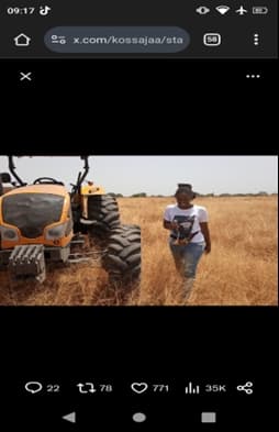 a man with a tractor in a farm